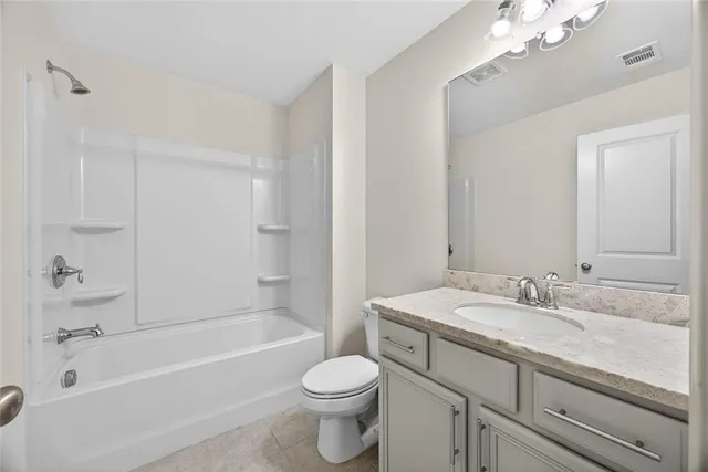 a front view of a house with a garage