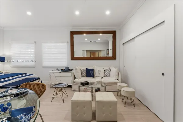 a kitchen with a sink and a mirror