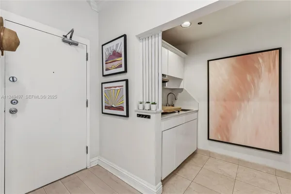 a kitchen with stainless steel appliances granite countertop a refrigerator and a stove