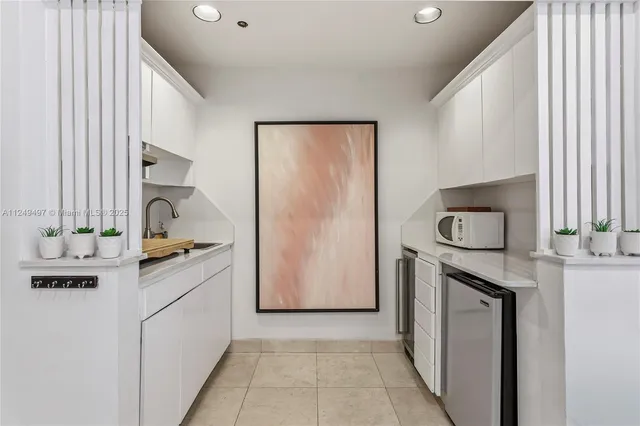 a kitchen with a refrigerator stove and sink