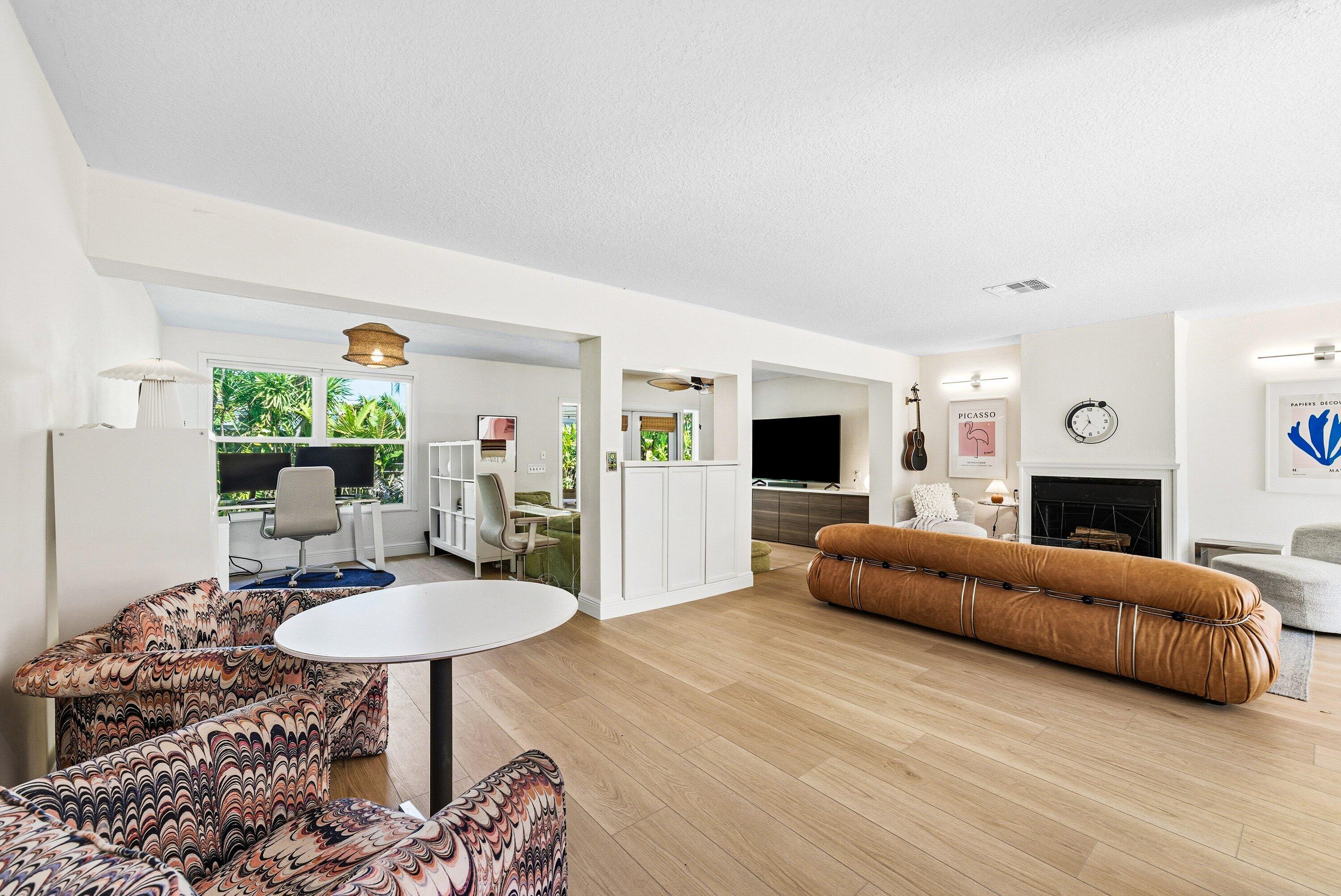 435 Northeast 35th Street Boca Raton, FL 33431 - Photo 17 of 62 a living room with furniture and a table