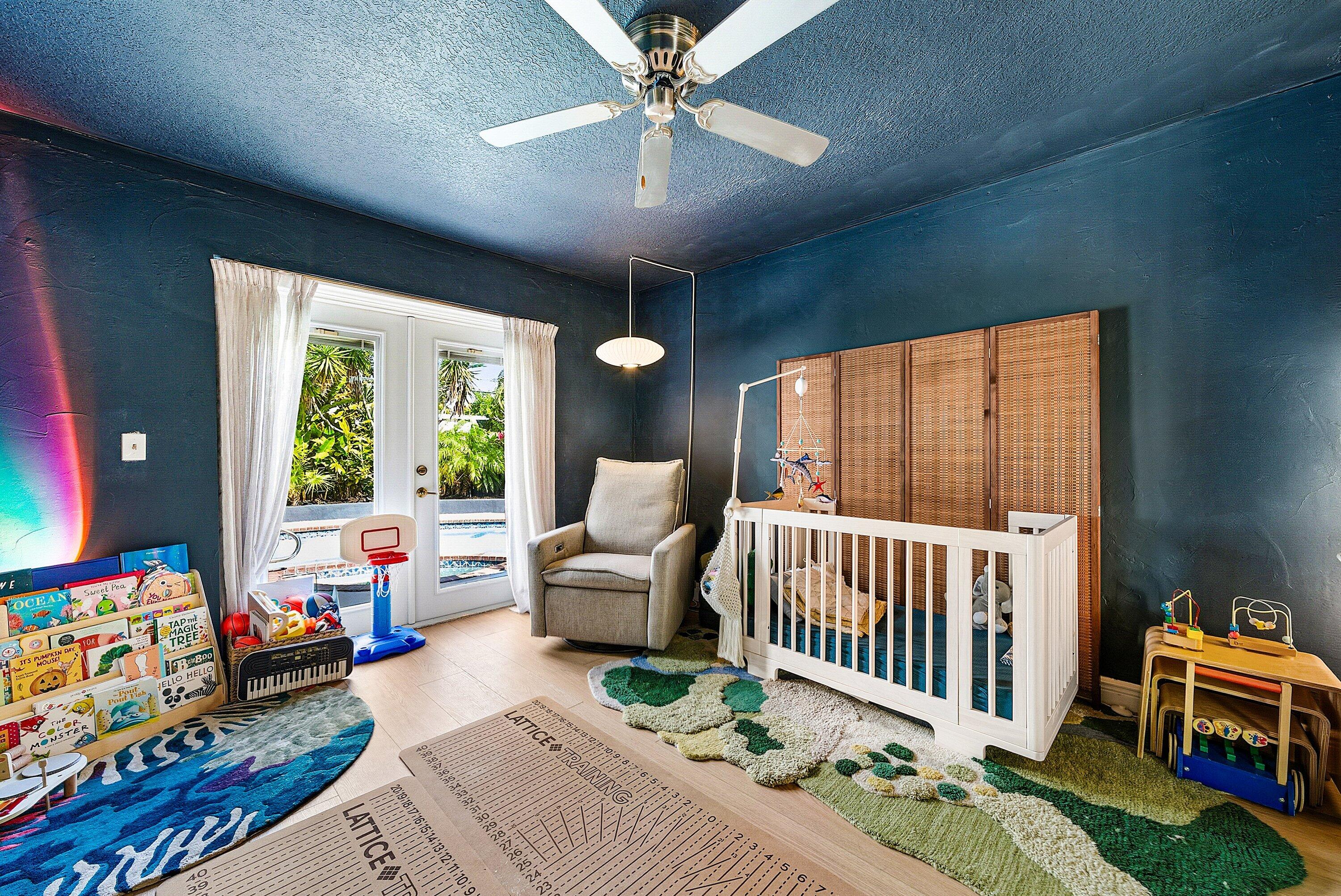 435 Northeast 35th Street Boca Raton, FL 33431 - Photo 27 of 62 a bedroom with furniture and a large window