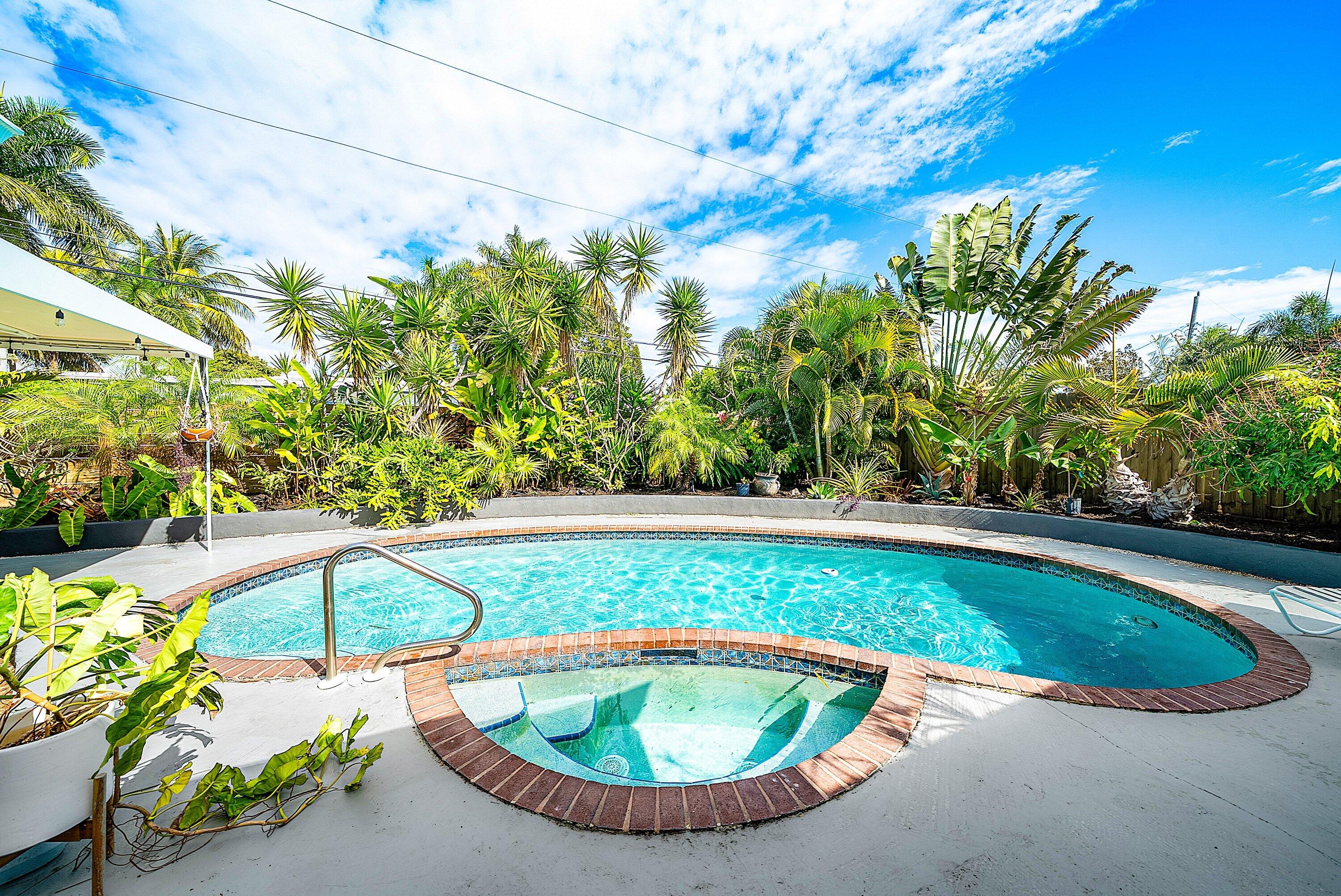 435 Northeast 35th Street Boca Raton, FL 33431 - Photo 36 of 62 a view of a swimming pool with a yard