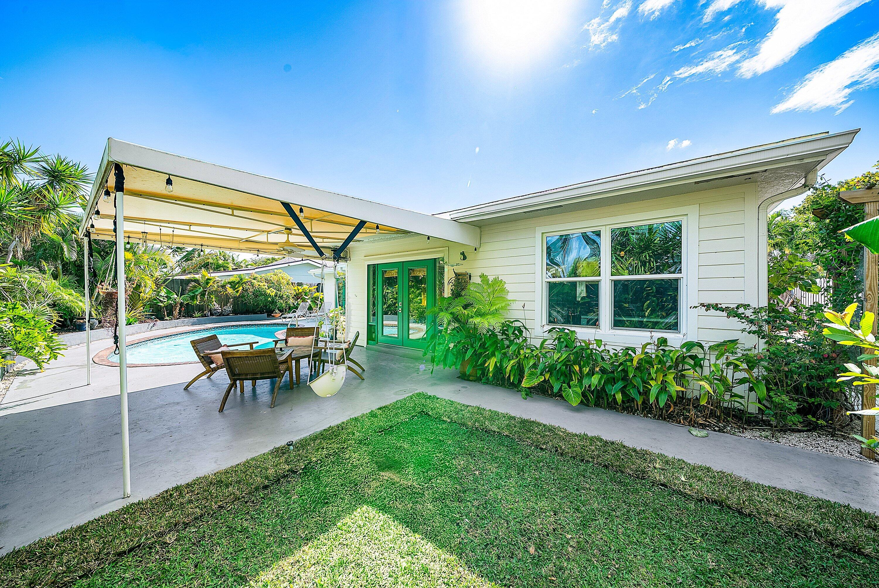 435 Northeast 35th Street Boca Raton, FL 33431 - Photo 43 of 62 a view of a house with backyard and sitting area