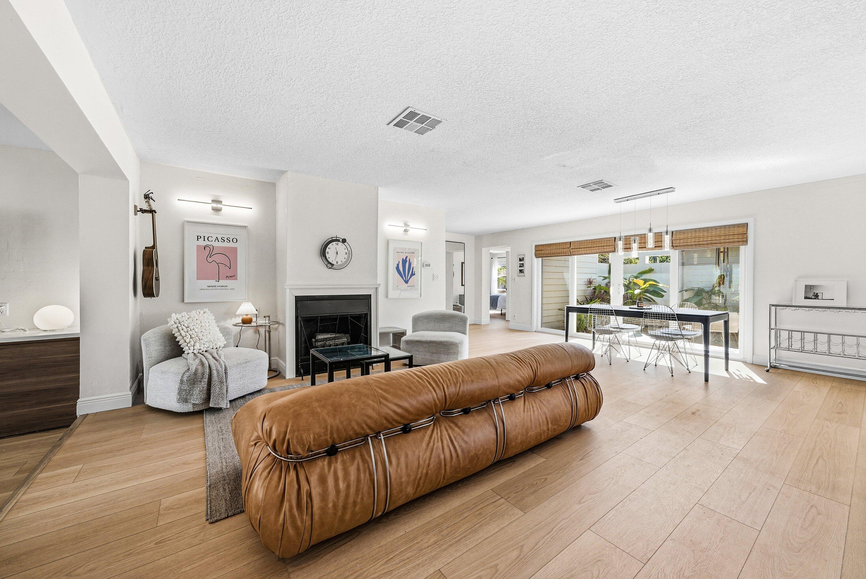 435 Northeast 35th Street Boca Raton, FL 33431 - Photo 10 of 62 a living room with furniture and a fireplace