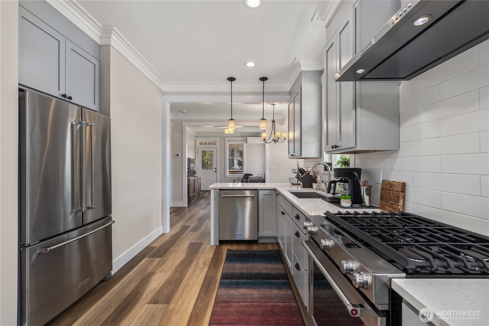 24 Switchback Lane Pacific Beach, WA 98571 - Photo 11 of 20 a kitchen with refrigerator a stove and cabinets