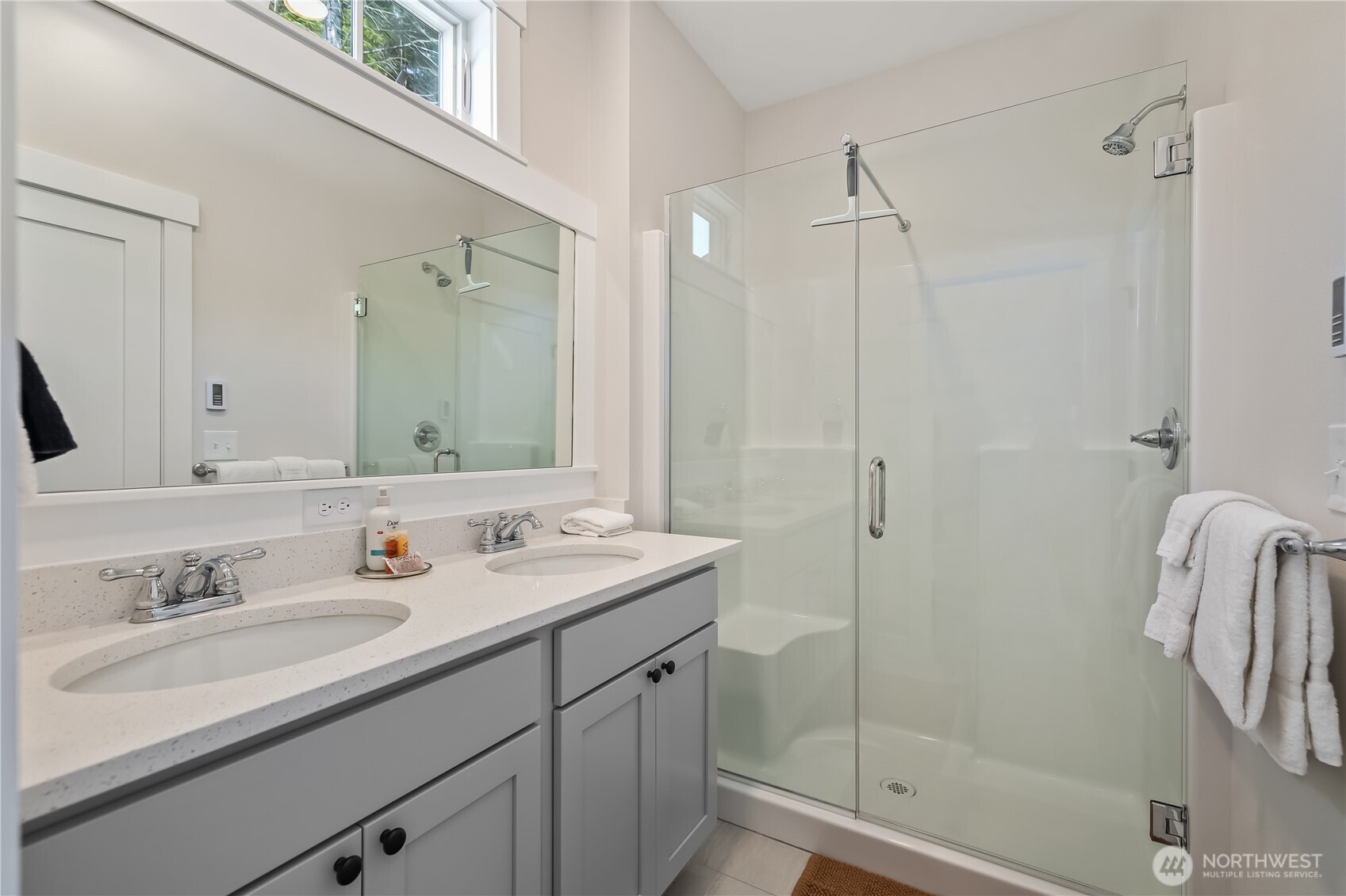 24 Switchback Lane Pacific Beach, WA 98571 - Photo 15 of 20 a bathroom with a shower sink and mirror