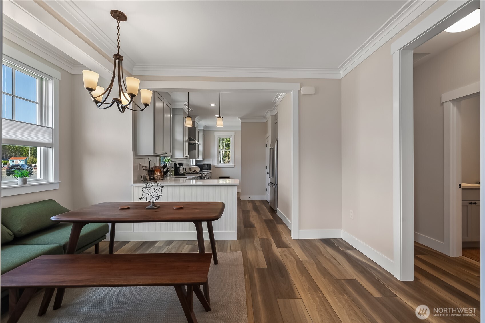 24 Switchback Lane Pacific Beach, WA 98571 - Photo 9 of 20 a room with a table chairs and wooden floor