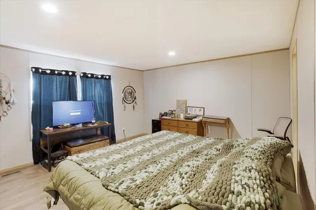 a bathroom with a sink toilet a mirror and shower