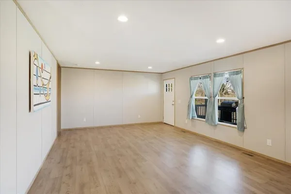 a view of a big house with a big yard