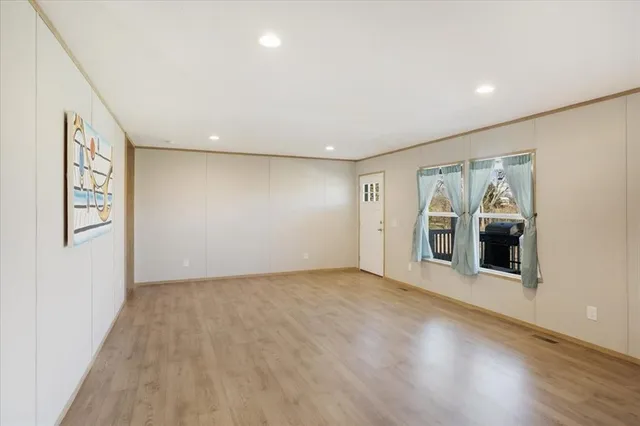 a view of a big house with a big yard