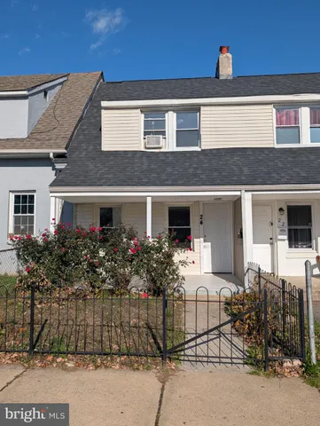 a front view of house with an outdoor space