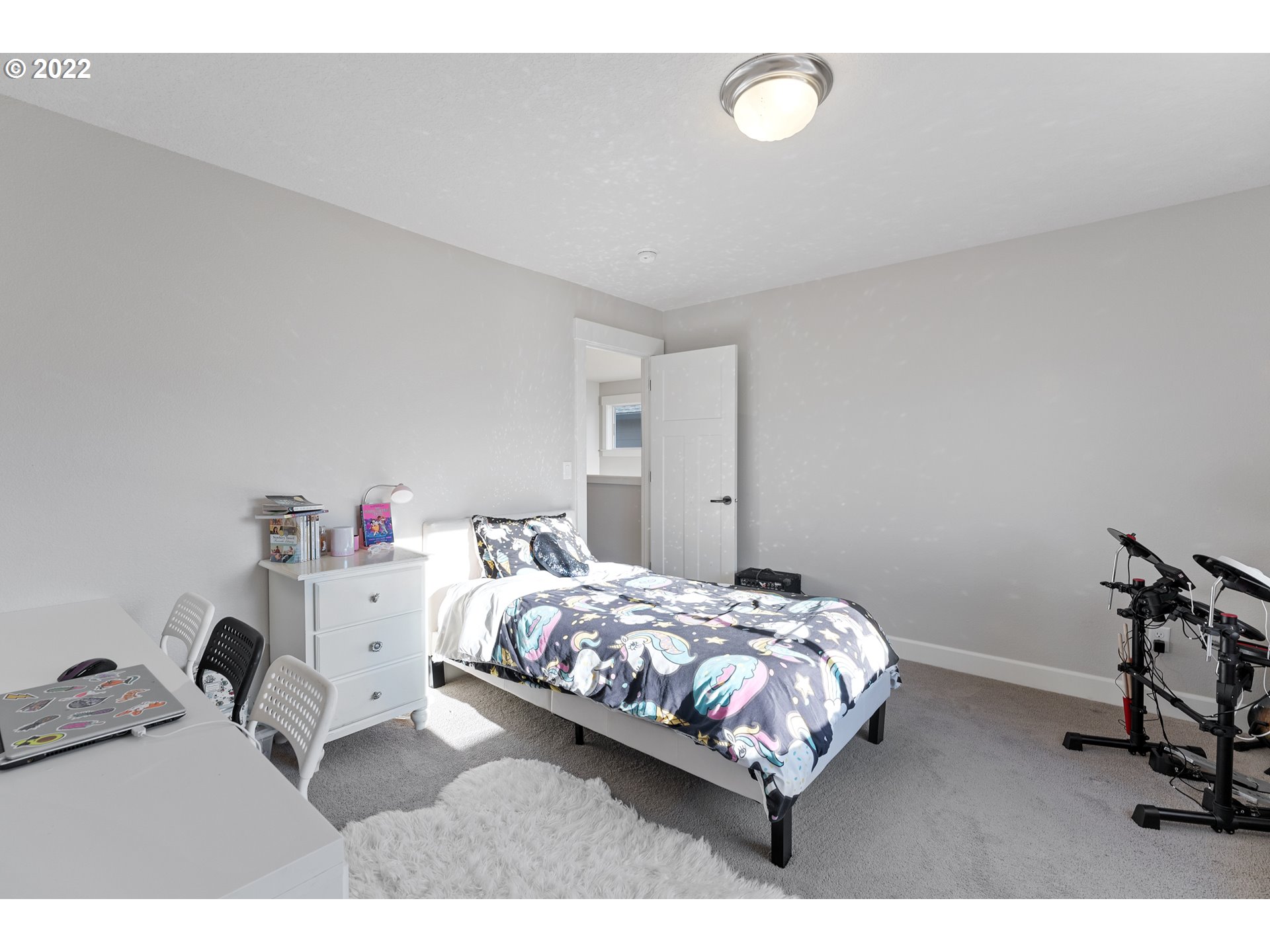 1146 South Quail Run Place Ridgefield, WA 98642 - Photo 25 of 32 a bedroom with a bed and a chair