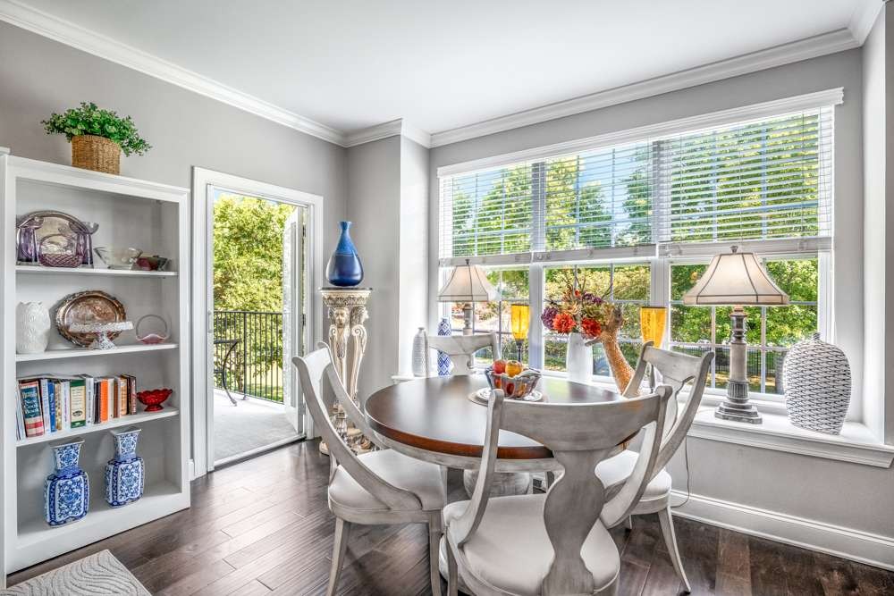 a view of a dining room with furniture window and wooden floor