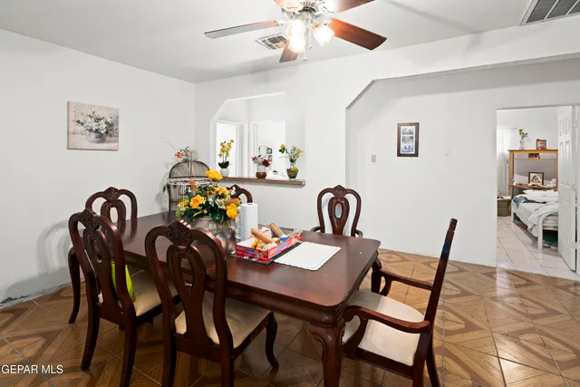 a view of a dining room with furniture and chandelier