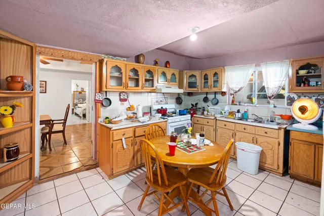 a kitchen with stainless steel appliances kitchen island granite countertop a sink and cabinets