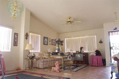 7220 North Artesiano Road Tucson, AZ 85743 - Photo 3 of 8 a living room with lots of furniture and view of kitchen