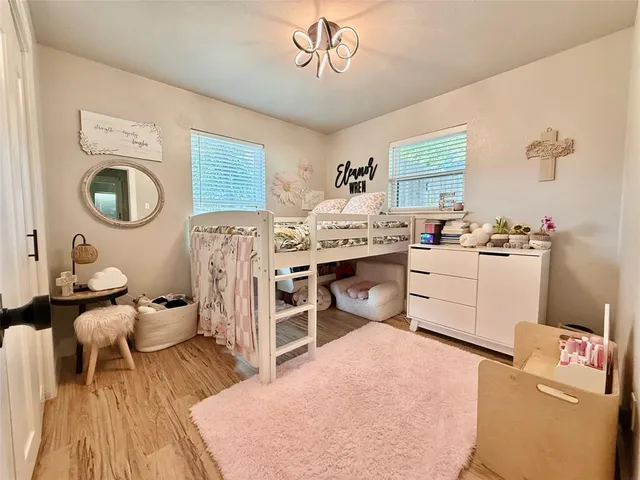 a bed room with a bed and a window