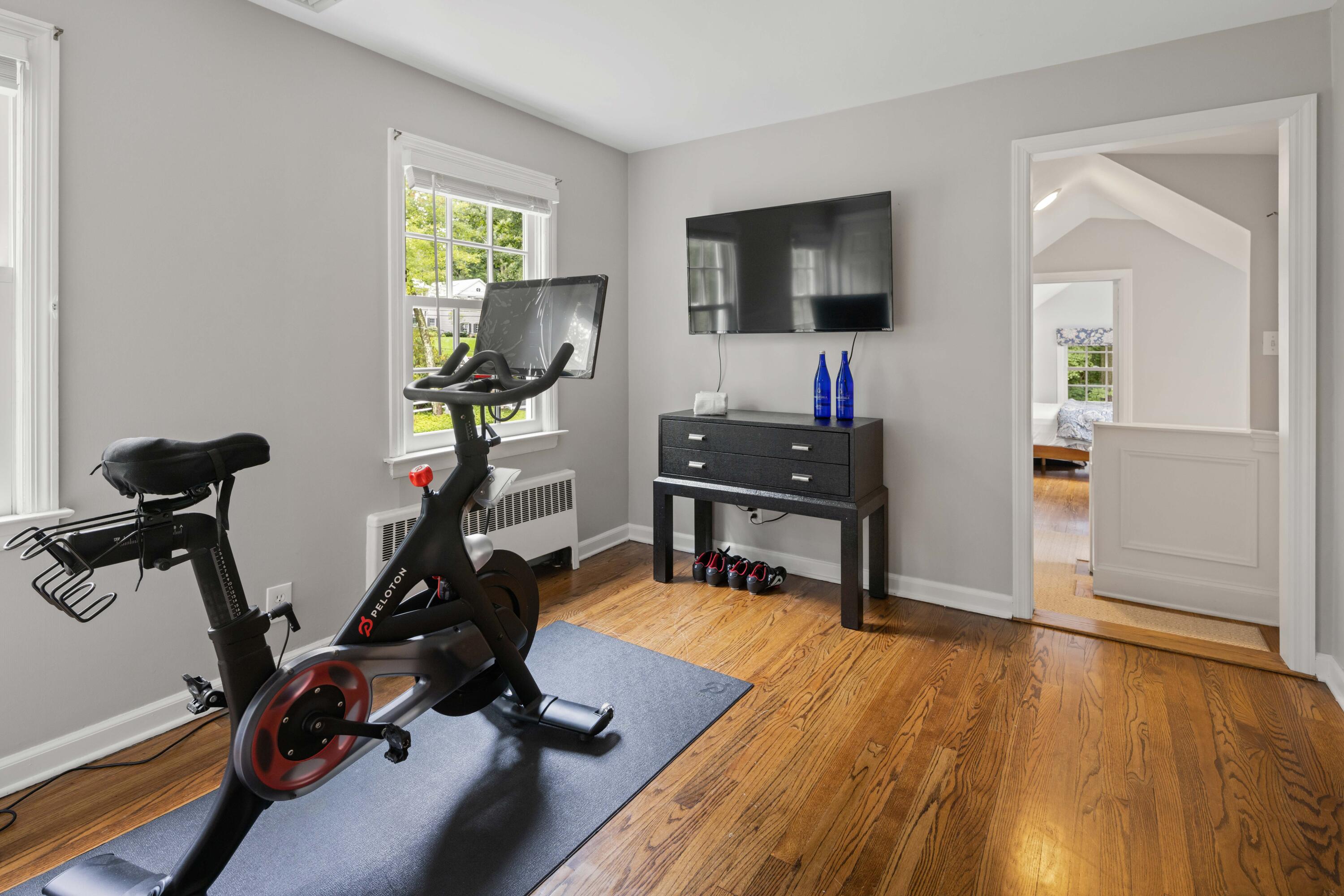 20 Maywood Road Darien, CT 06820 - Photo 22 of 27 a view of a workspace with furniture and a flat screen tv