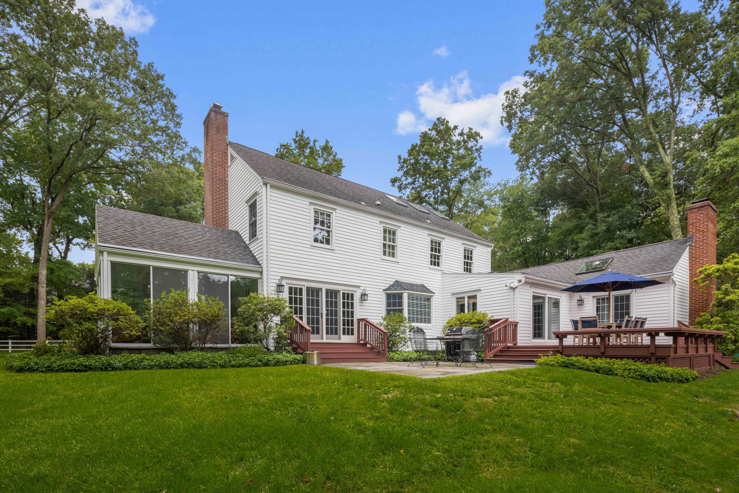 20 Maywood Road Darien, CT 06820 - Photo 26 of 27 a view of a house with a yard and a patio