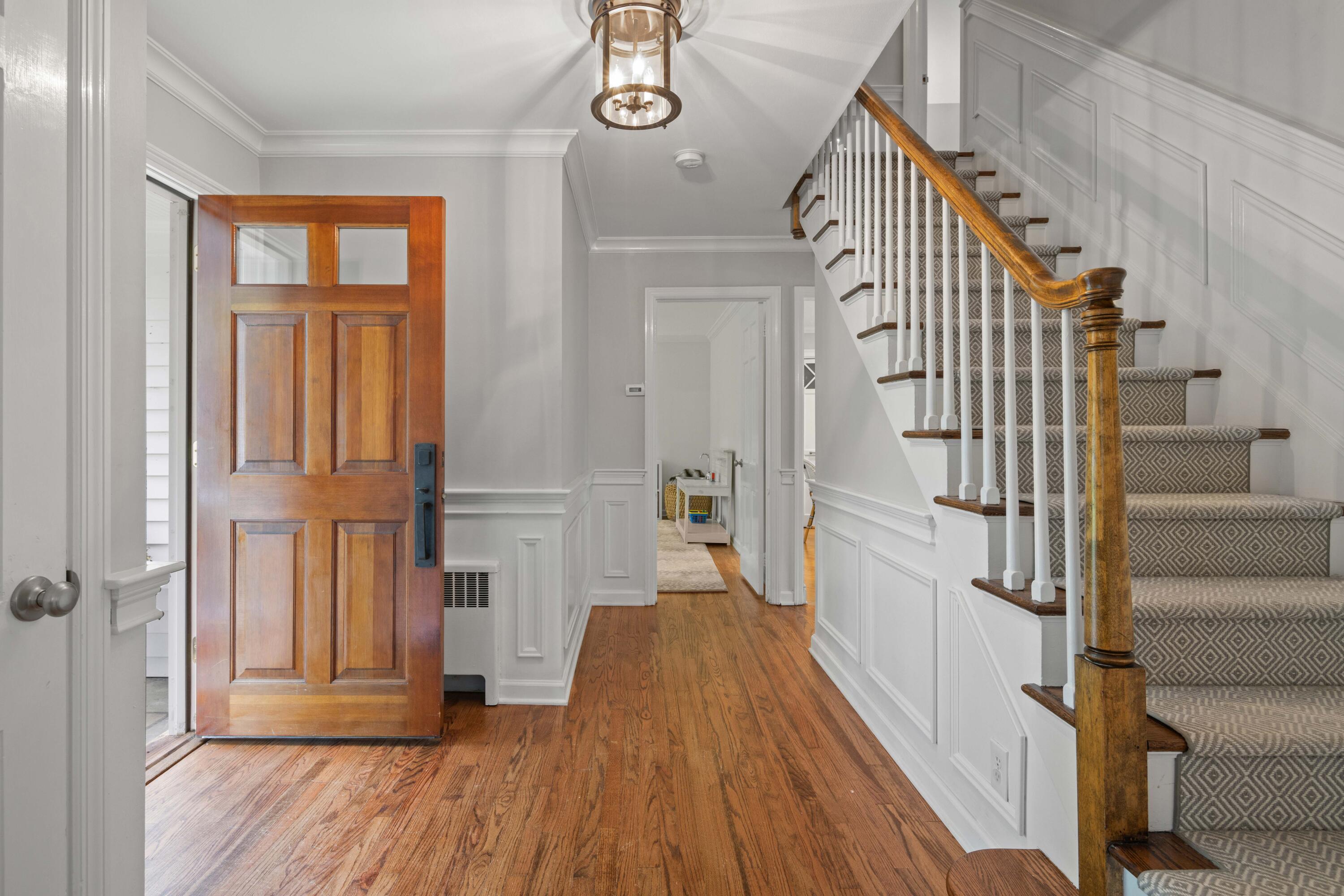 20 Maywood Road Darien, CT 06820 - Photo 8 of 27 a view of a hallway with wooden floor and staircase