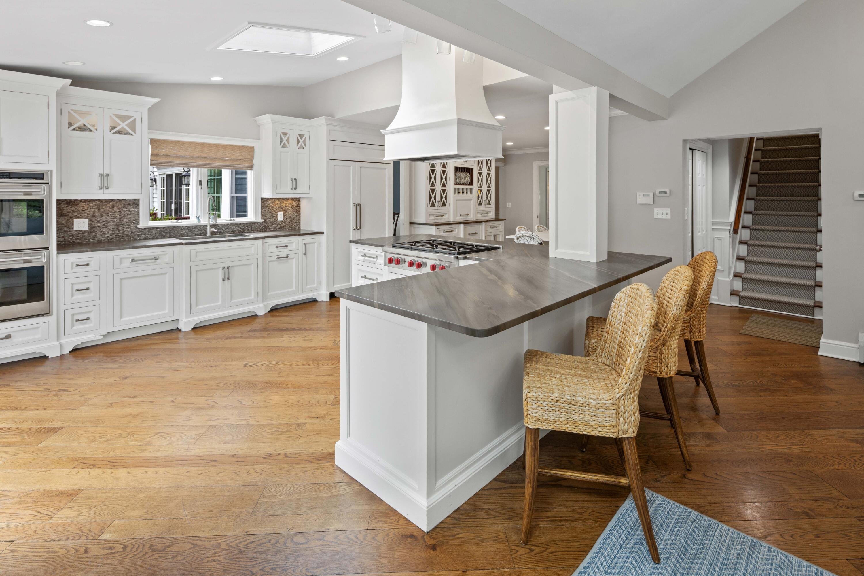 20 Maywood Road Darien, CT 06820 - Photo 10 of 27 a living room with furniture and a kitchen view