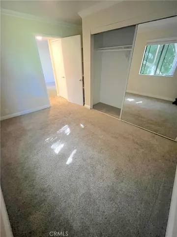 a view of empty room with large window