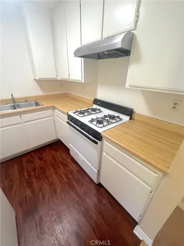 a kitchen with a stove and a microwave