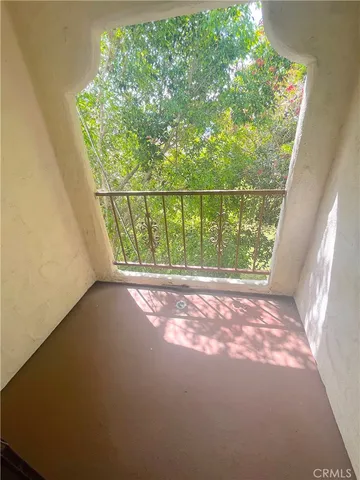 a view of balcony with yard
