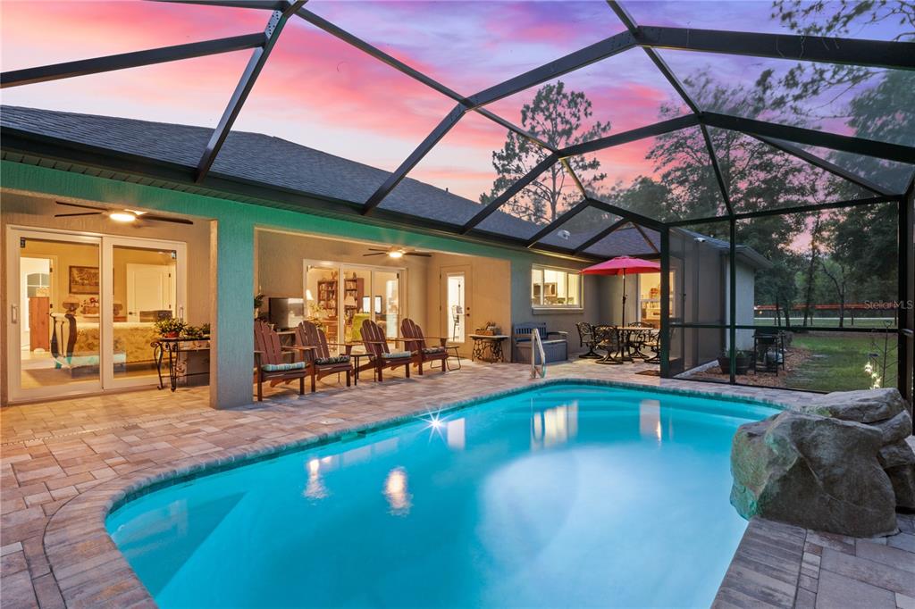 12929 Southwest 89th Street Dunnellon, FL 34432 - Photo 48 of 76 a view of a swimming pool with a patio