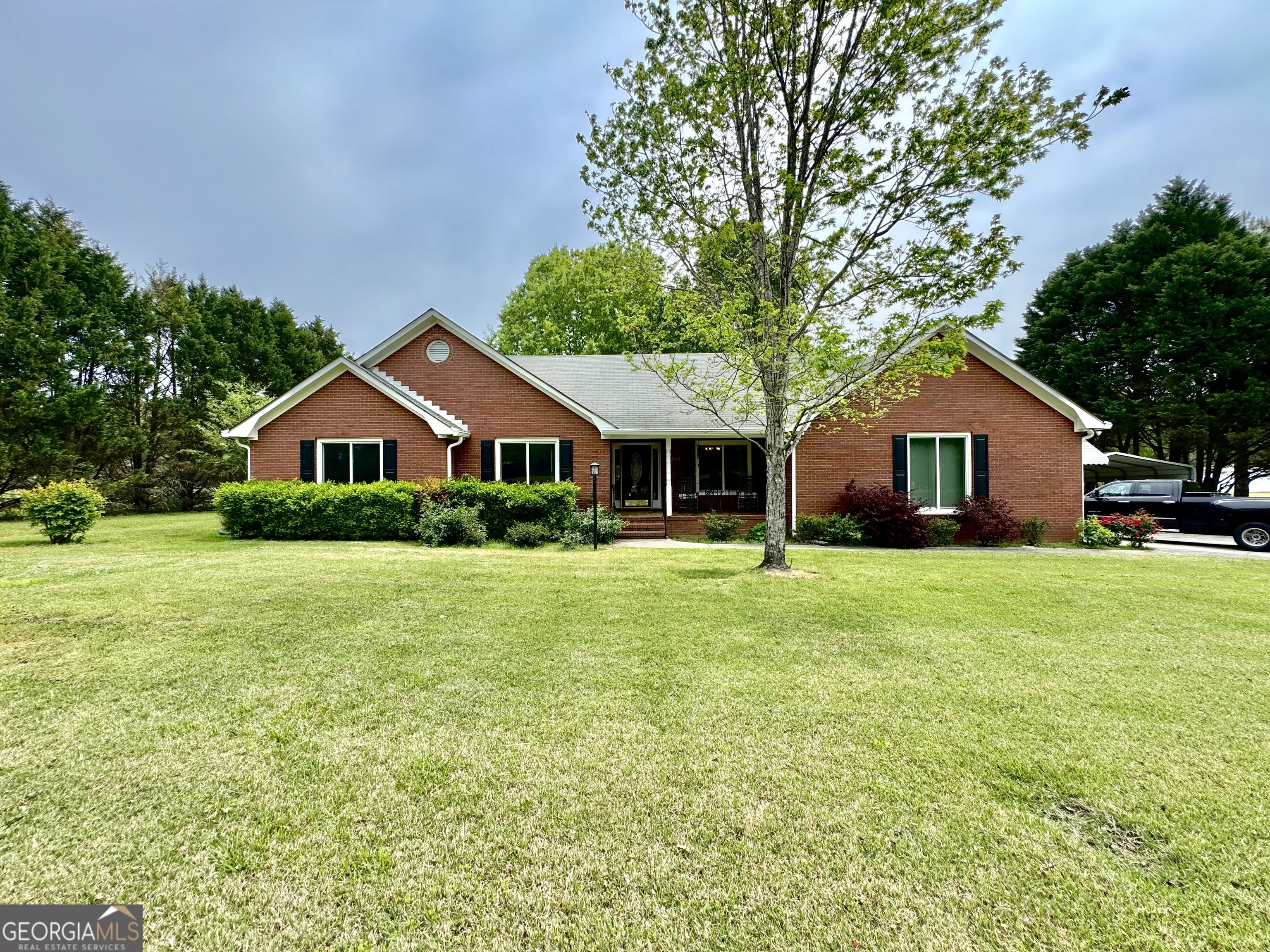 2660 Beeks Road Williamson, GA 30292 - Photo 1 of 1 a front view of house with yard and green space