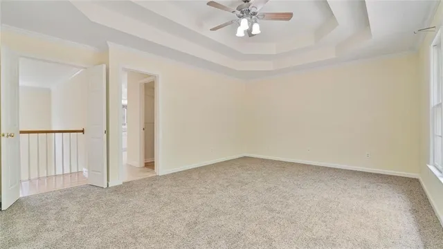 a bathroom with a granite countertop sink a toilet and a shower