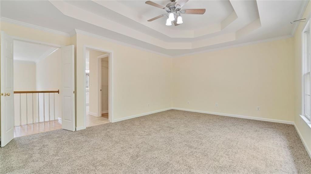 4612 Springside Court Southwest Mableton, GA 30126 - Photo 17 of 40 an empty room with a chandelier fan