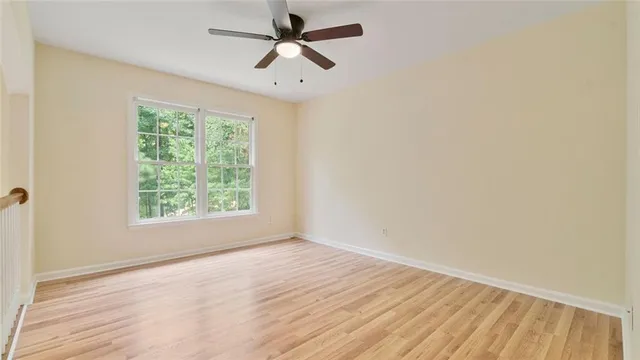 a bathroom with a granite countertop sink a toilet and bathtub