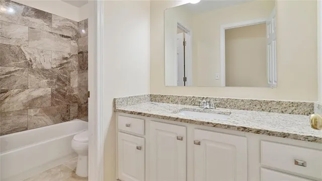 an empty room with wooden floor a fireplace