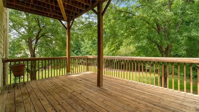 a view of balcony with wooden floor