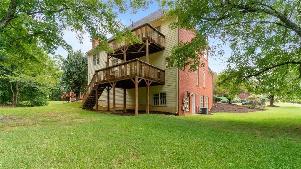 4612 Springside Court Southwest Mableton, GA 30126 - Photo 30 of 40 a view of a house with a big yard