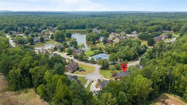 an aerial view of a house with a swimming pool
