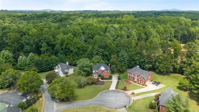 a house with huge green field in front of it