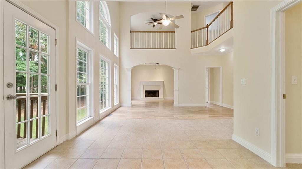 4612 Springside Court Southwest Mableton, GA 30126 - Photo 7 of 40 a view of an empty room with a fireplace and a window