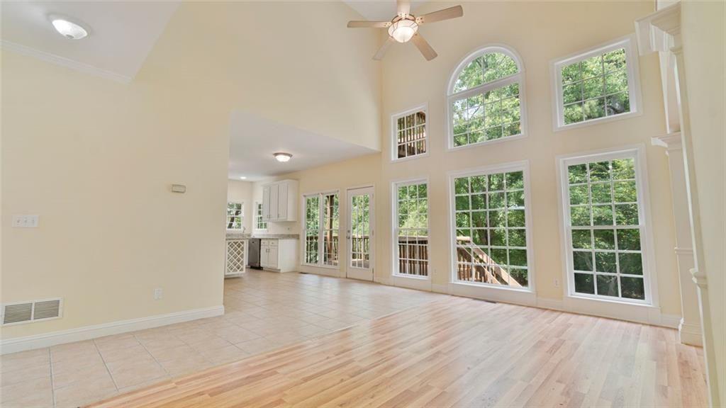 4612 Springside Court Southwest Mableton, GA 30126 - Photo 8 of 40 an empty room with wooden floor and windows