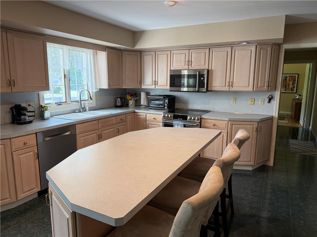 4114 Rochelle Drive Allentown, PA 18104 - Photo 11 of 35 A well-equipped kitchen boasts a central island and abundant cabinetry for culinary pursuits.
