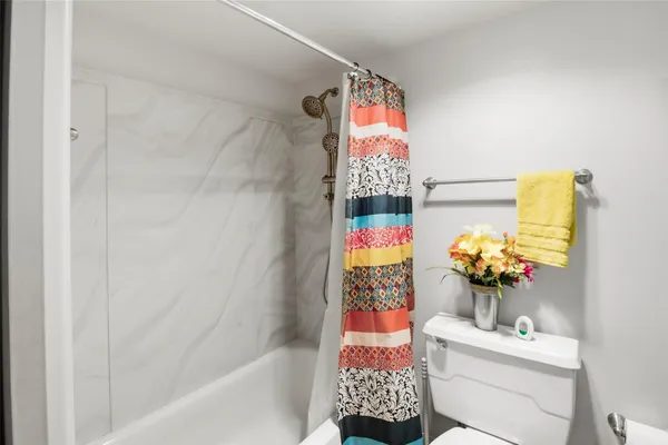 a living room with lots of furniture and white walls