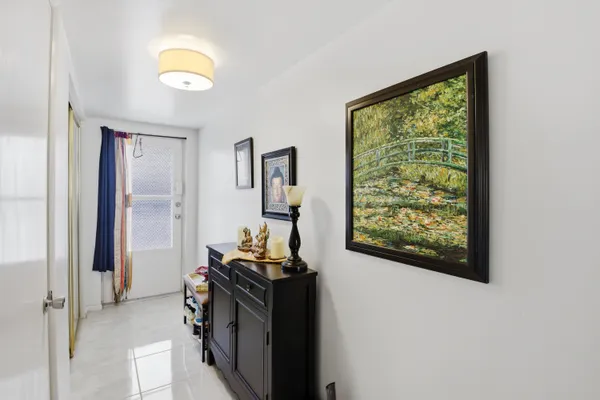 a living room with furniture a rug and a large window