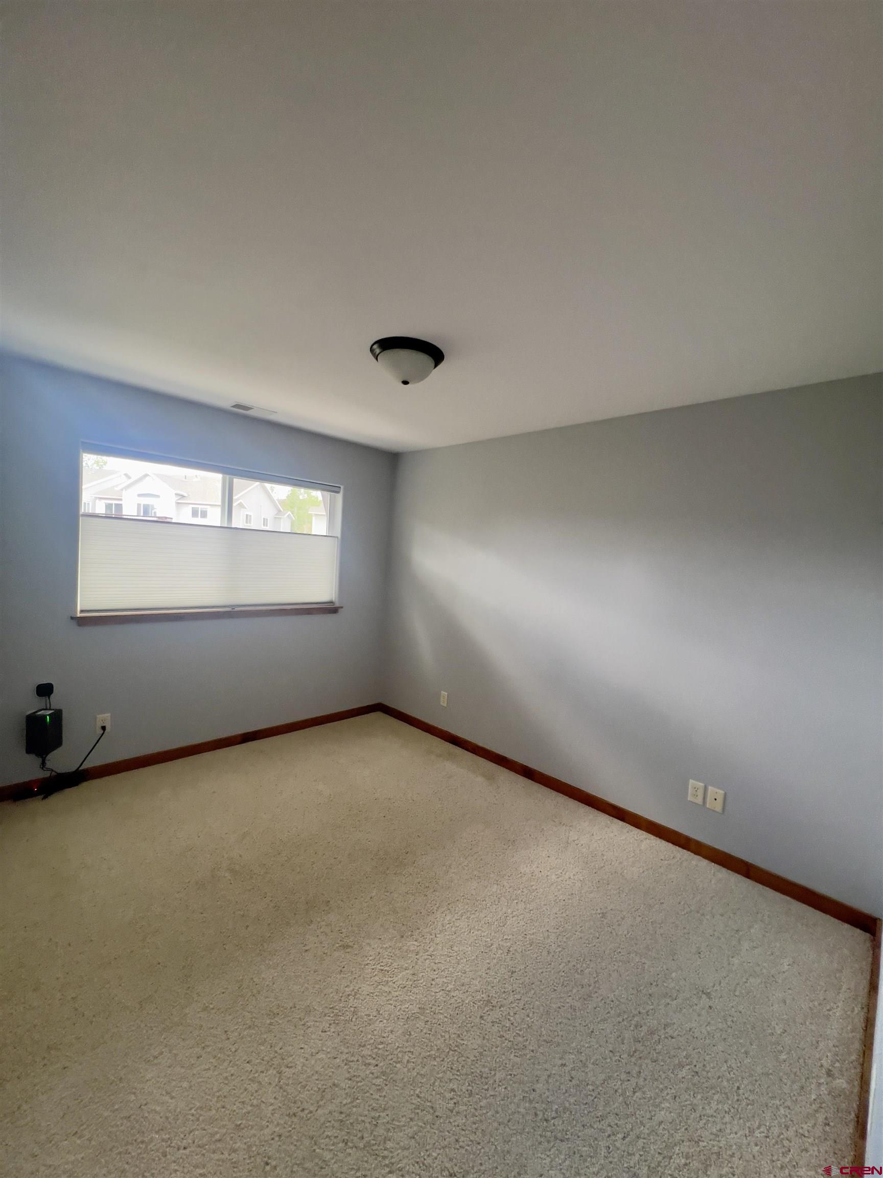 540 Redcliff Circle, Unit E 203 Ridgway, CO 81432 - Photo 19 of 36 an empty room with a window