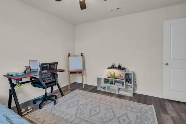 a bedroom with a bed and a table