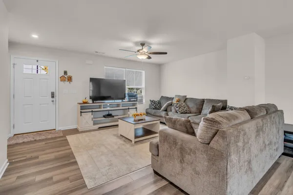 a living room with furniture and a flat screen tv