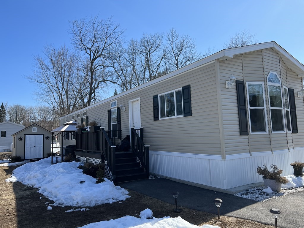 a view of house with yard