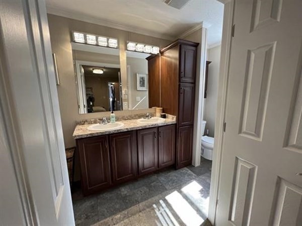 28 Grappone Drive Concord, NH 03301 - Photo 14 of 20 a bathroom with a double vanity sink and a mirror