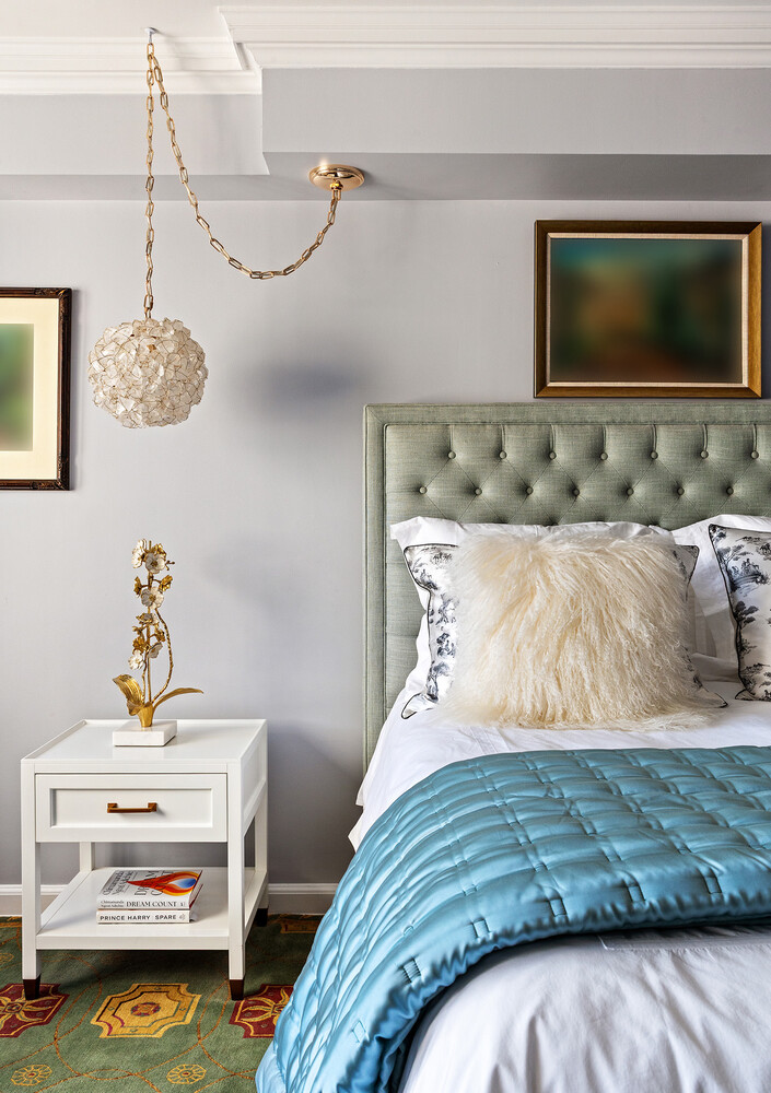 45 Sutton Place South, Unit 10H Manhattan, NY 10022 - Photo 13 of 18 a bedroom with a bed and flat screen tv